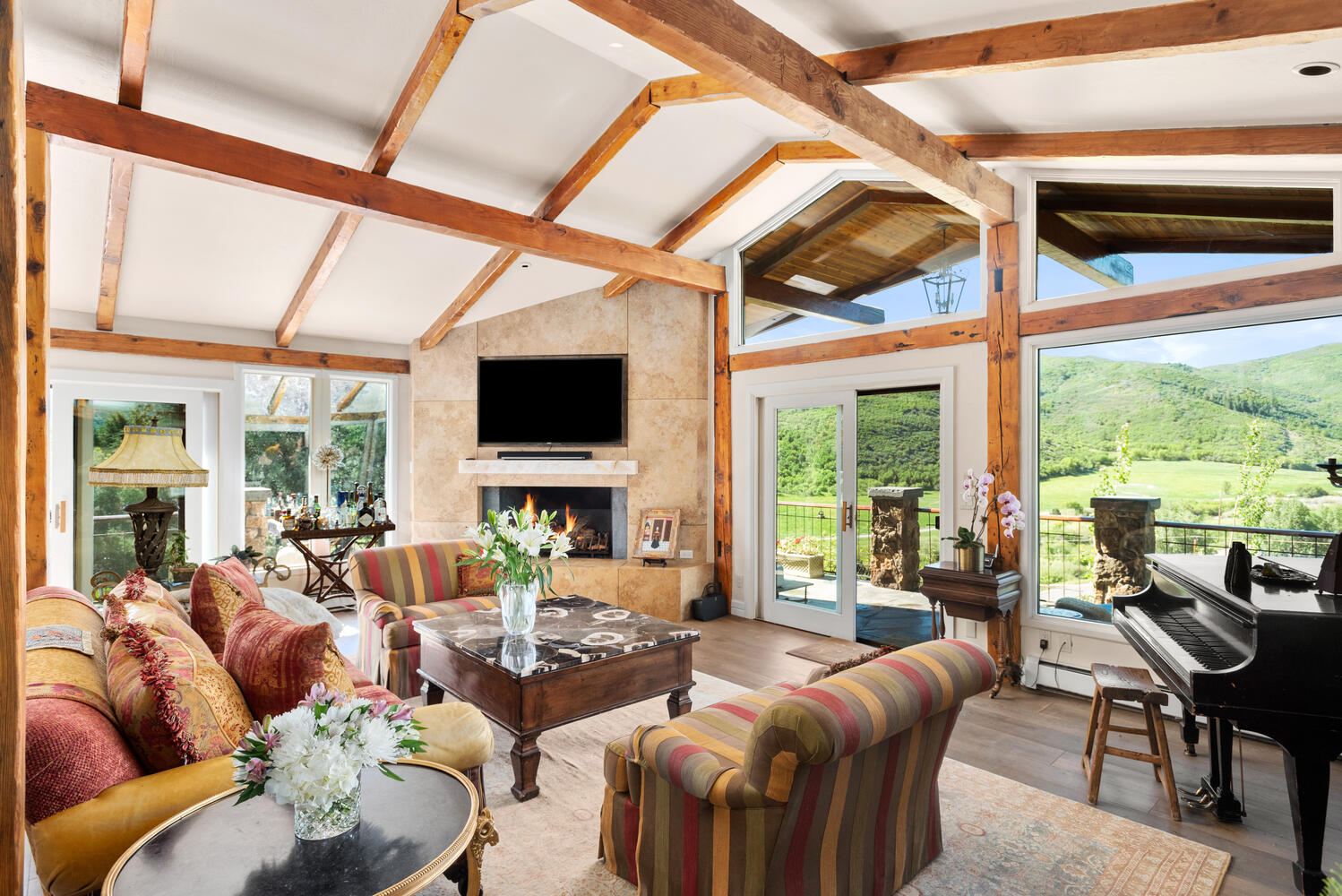 living room with walls of glass at 70 Medicine Bow