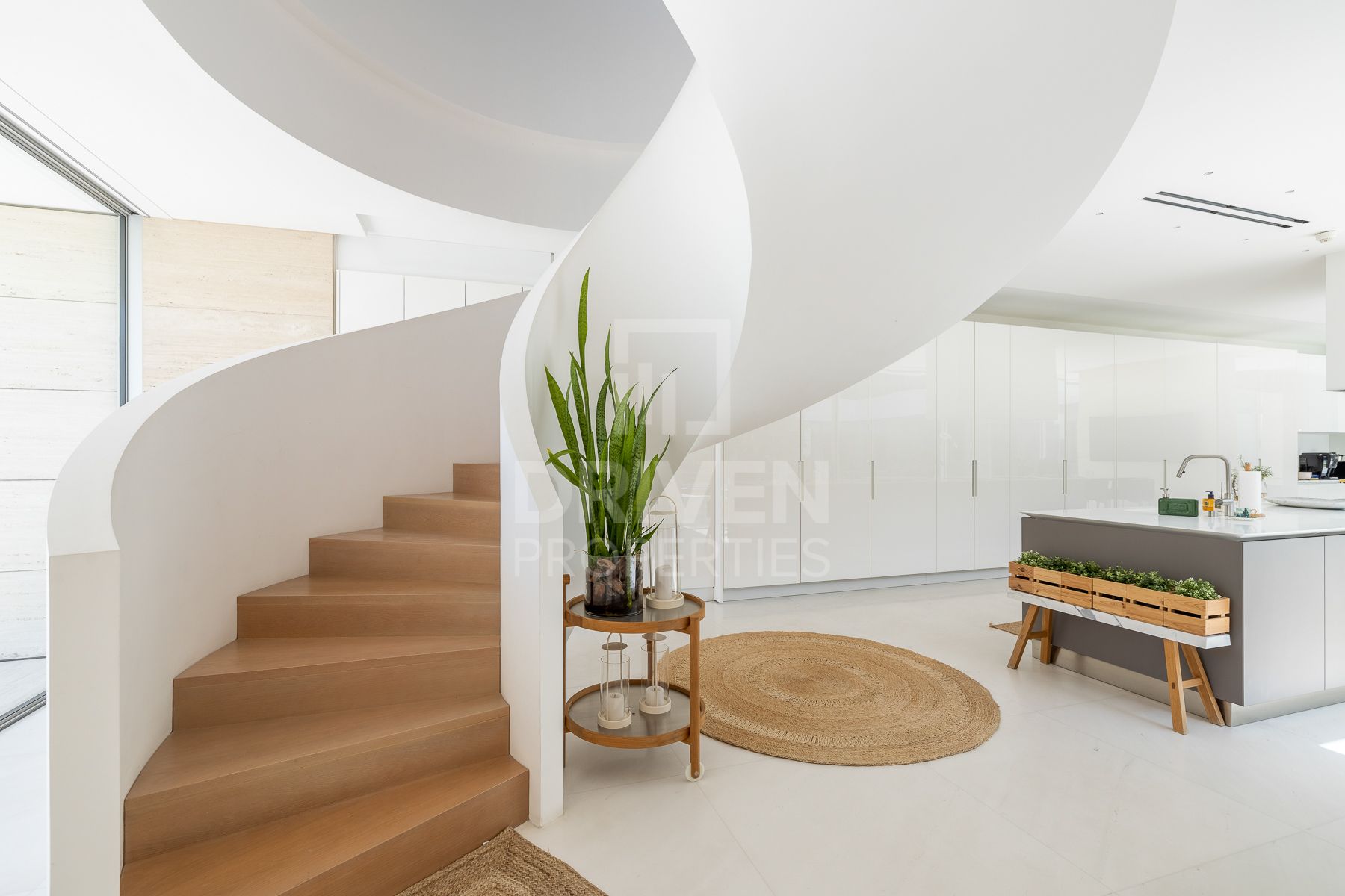 sculptural staircase inside a modern villa in dubai's jumeirah