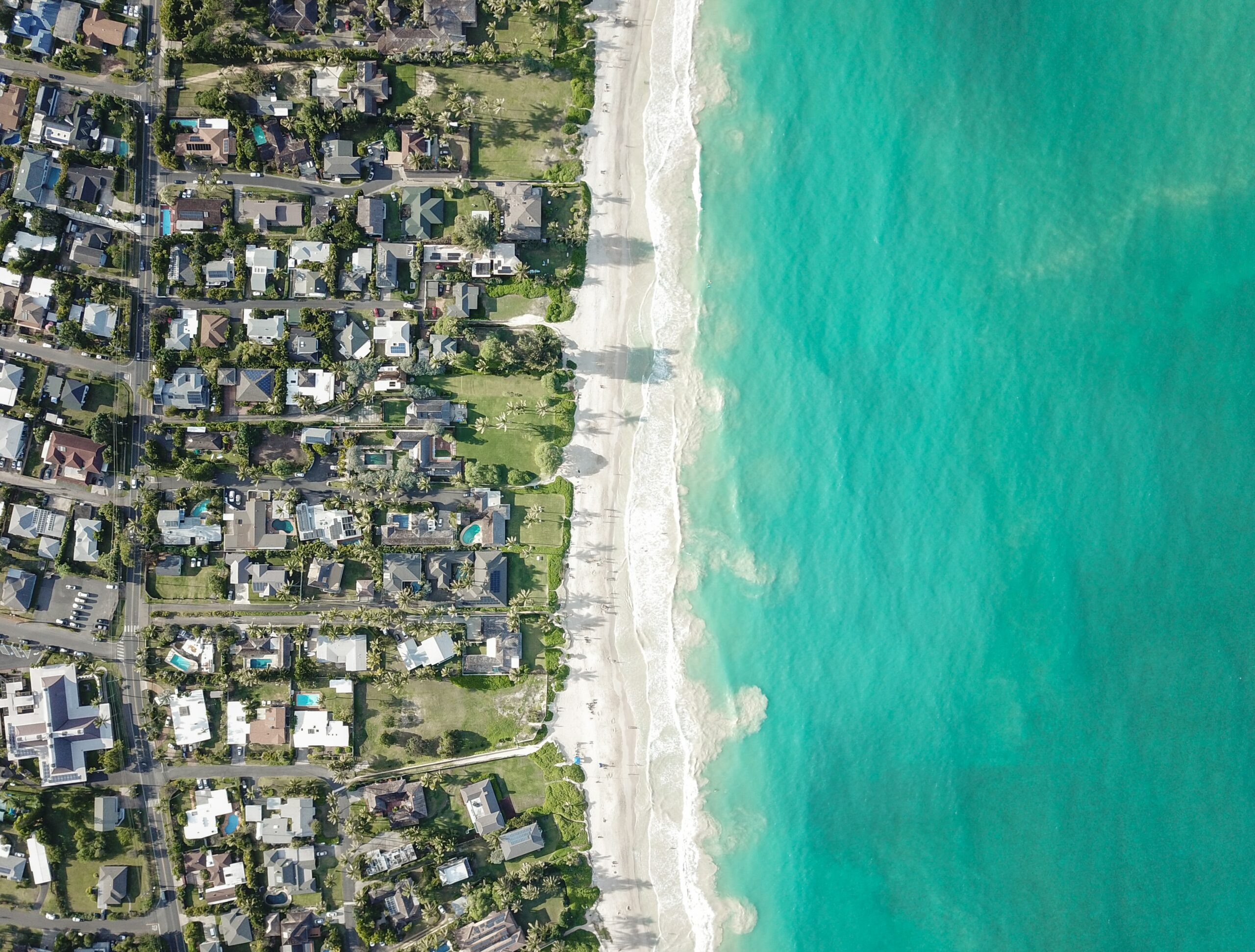 aerial view of homes and ocean in hawaii