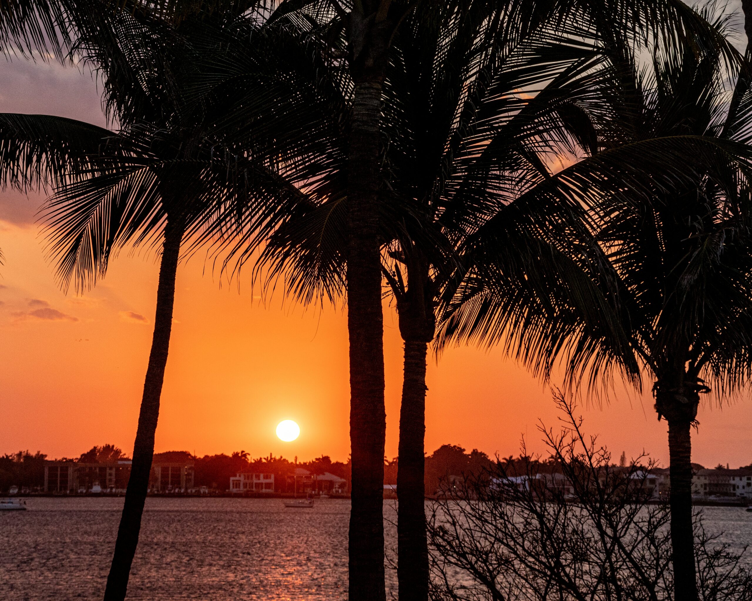 manalapan florida orange sunset over luxury homes