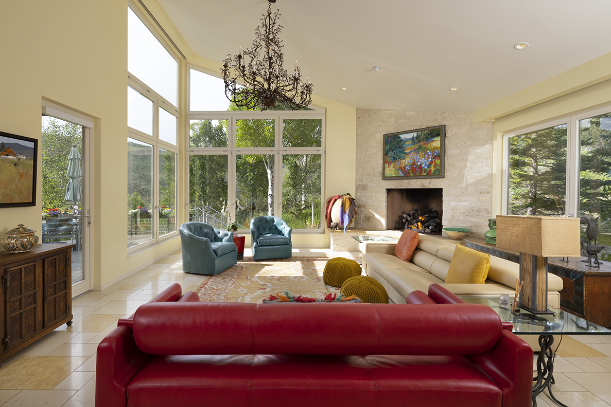 interior view of the living room with large floor to ceiling windows
