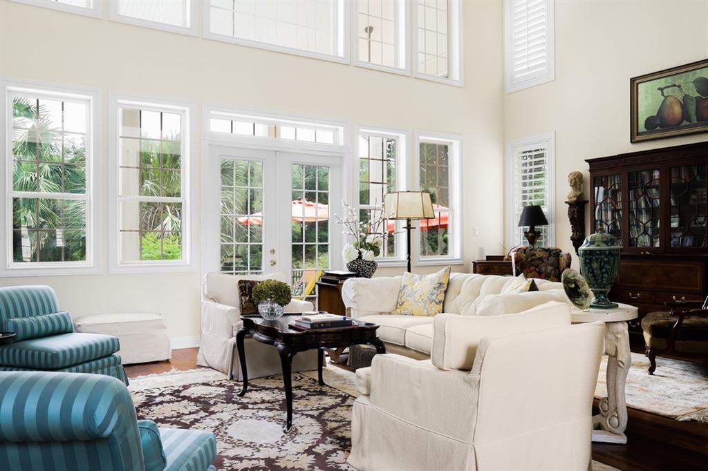 Interior view of a living room with plenty of windows.